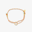 Bracelet with orange and gold accents on a white background